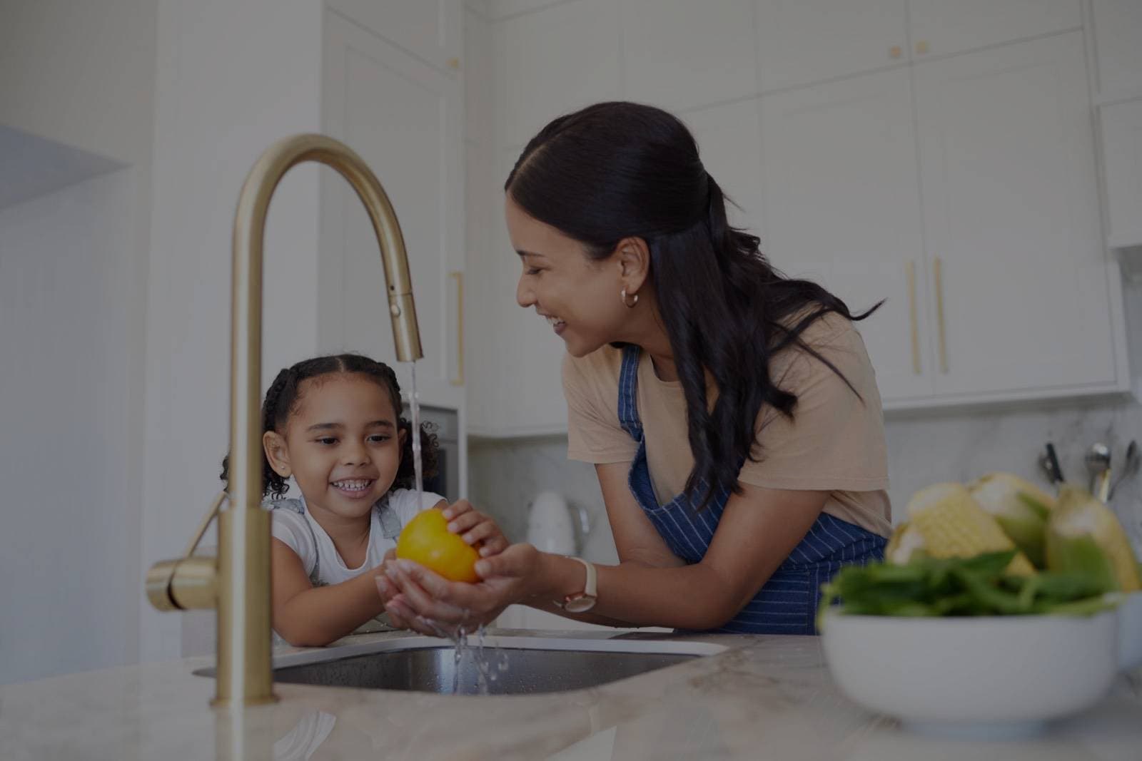 Family at kitchen sink